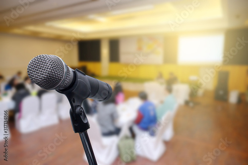 Microphone over the blurred business forum Meeting or Conference Room Concept, Blurred background.