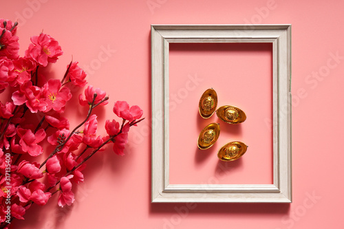Chinese New Year concept with frame and ingots