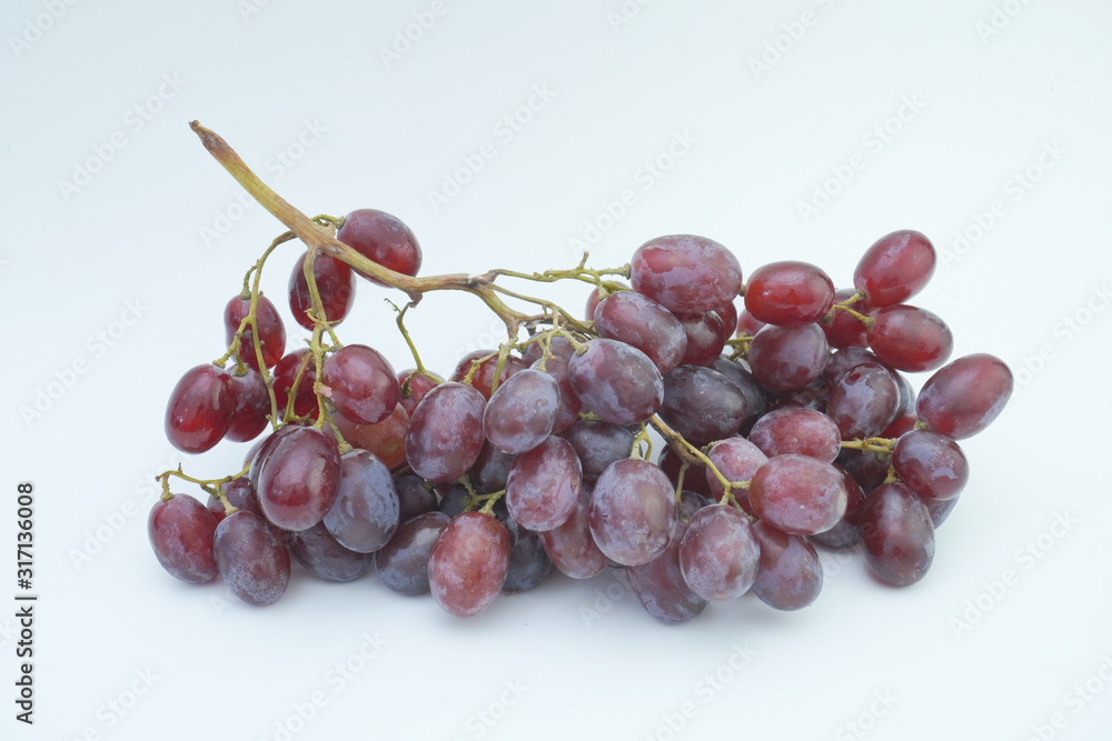 Fresh bunch of grapes on white background.