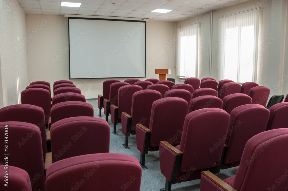 Modern conference room with comfortable Burgundy chairs