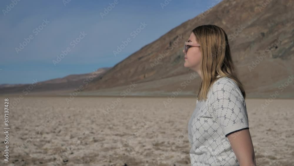 Exploration and adventure travel, attractive young woman on salt lake Exploration and adventure travel, attractive young woman on salt lake
