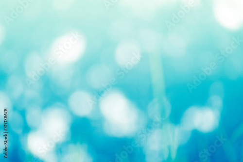 The abstract background of blurred and soft blue bokeh