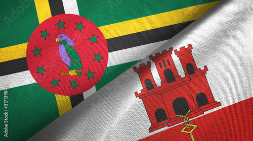 Dominica and Gibraltar two flags textile cloth, fabric texture photo