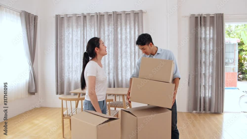 Asian Couple In New House At Moving Day Asian Couple In New House At Moving Day