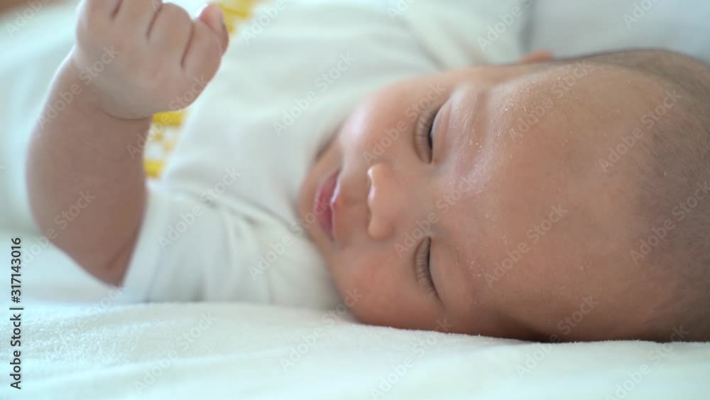 Close up shot of crying newborn baby on bed at home. Hungry baby infant boy cry for milk Close up shot of crying newborn baby on bed at home. Hungry baby infant boy cry for milk
