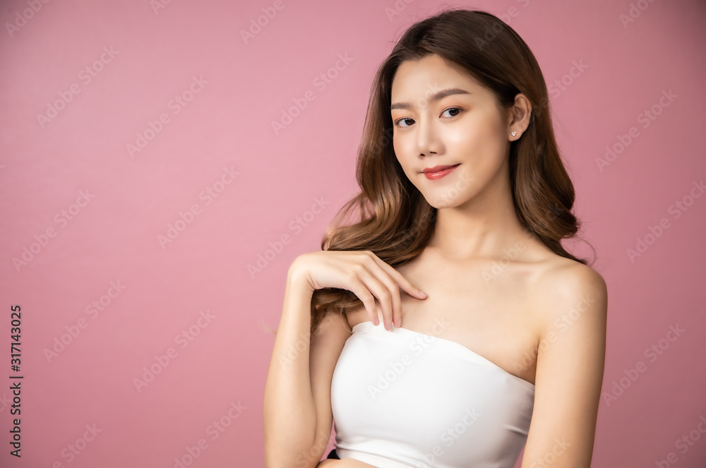 Beautiful Young Asian Woman short hair with Clean Fresh Skin. Face care, Facial treatment, Cosmetology, beauty and healthy skin and cosmetic ideas concept.pretty woman holding half of orange . Beautiful Young Asian Woman short hair with Clean Fresh Skin. Face care, Facial treatment, Cosmetology, beauty and healthy skin and cosmetic ideas concept.pretty woman holding half of orange .
