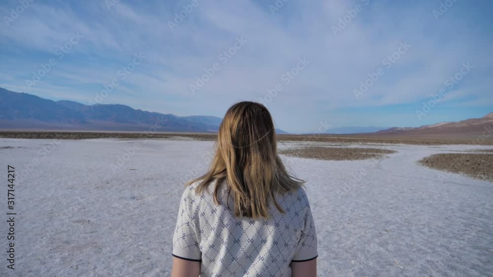 Travel and adventure freedom young woman big open space salt lake Death Valley Travel and adventure freedom young woman big open space salt lake Death Valley
