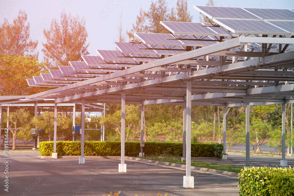 Obraz premium Solar power panels installed on the roof of the parking lot. Which is the most efficient use Due to the limited area.