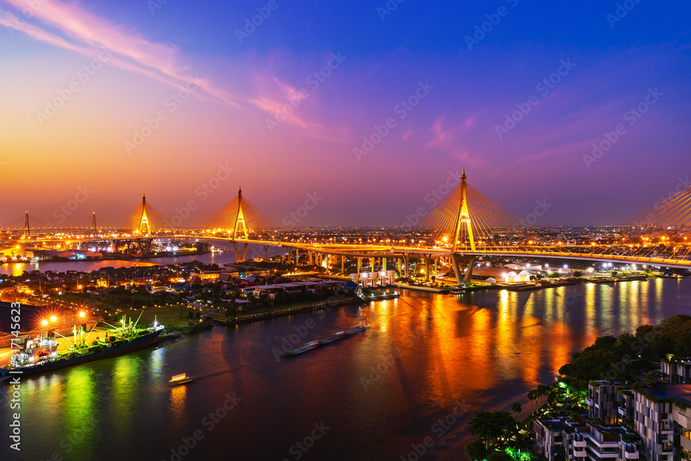 Bhumibol suspension bridge over Chao Phraya River with sunrise in Bangkok city, Thailand