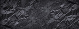 Black white stone background. Dark gray grunge banner. Mountain texture. Close-up. Volumetric. Rock background with space for design. Detail. Wide banner. Long. Panoramic.
