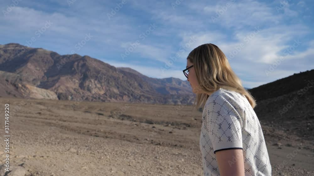 Exploration and adventure travel attractive young woman hiking in desert Exploration and adventure travel attractive young woman hiking in desert