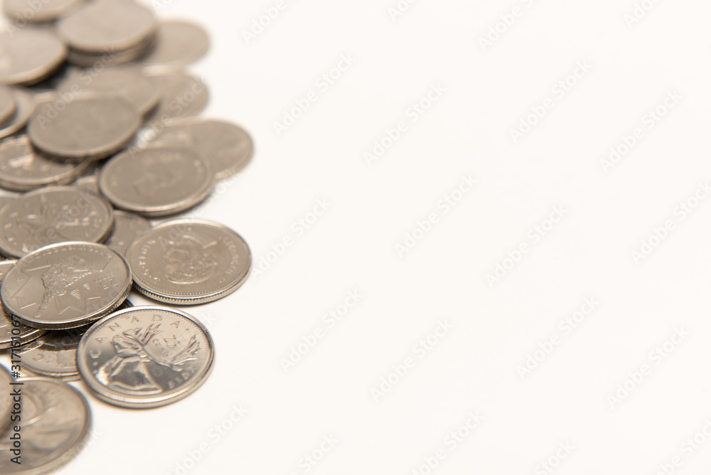 Canadian quarters isolated on white background with copy space. Canadian quarters isolated on white background with copy space.