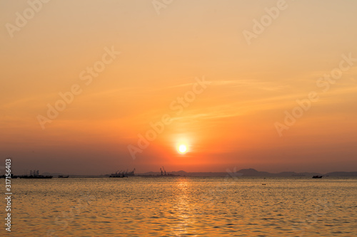 Silhouette of Harbor with sunset in Sriracha Chonburi, Thailand © phollapat