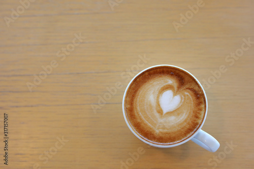 hot latte coffee drink put on wooden table in cafe restaurant