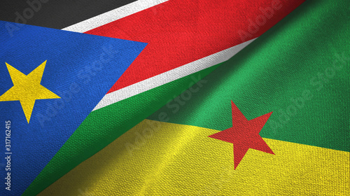 South Sudan and French Guiana two flags textile cloth, fabric texture photo