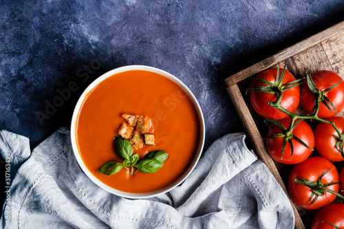 Tomato soup with basil in a bowl
