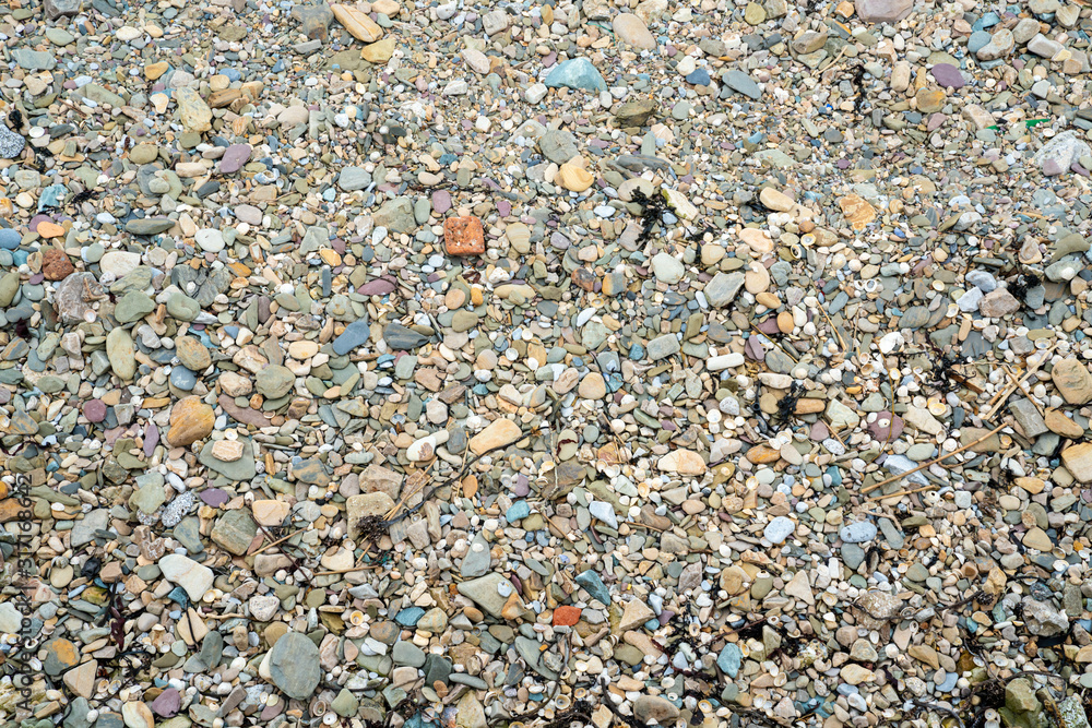 Colorful small stones on the beach Colorful small stones on the beach