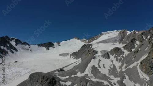 Grigorievskoe gorge in the summer in Kungei Alatau. Kyrgyzstan.  Forest, Alpine meadows and glaciers. photo