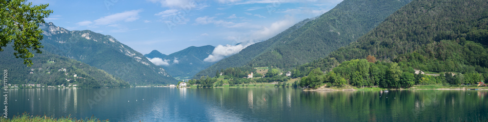 Fototapeta premium Ledro, Italy. The Ledro lake is a natural alpine lake. Amazing turquoise, green and blue colors. Italian Alps. Touristic destination. Summer time