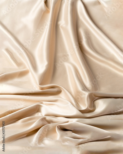 Abstract white wavy textile silk background with milky, creamy, champagne color