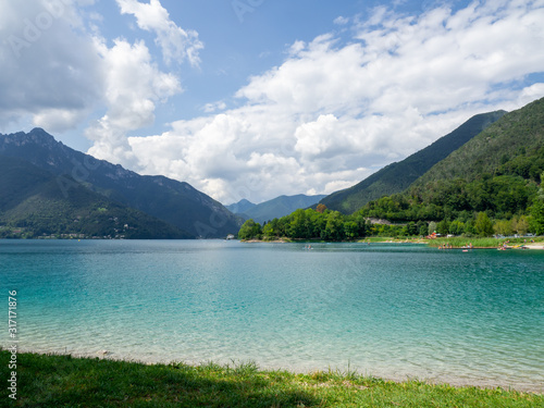 Ledro, Italy. The Ledro lake is a natural alpine lake. Amazing turquoise, green and blue colors. Italian Alps. Touristic destination. Summer time © Matteo Ceruti