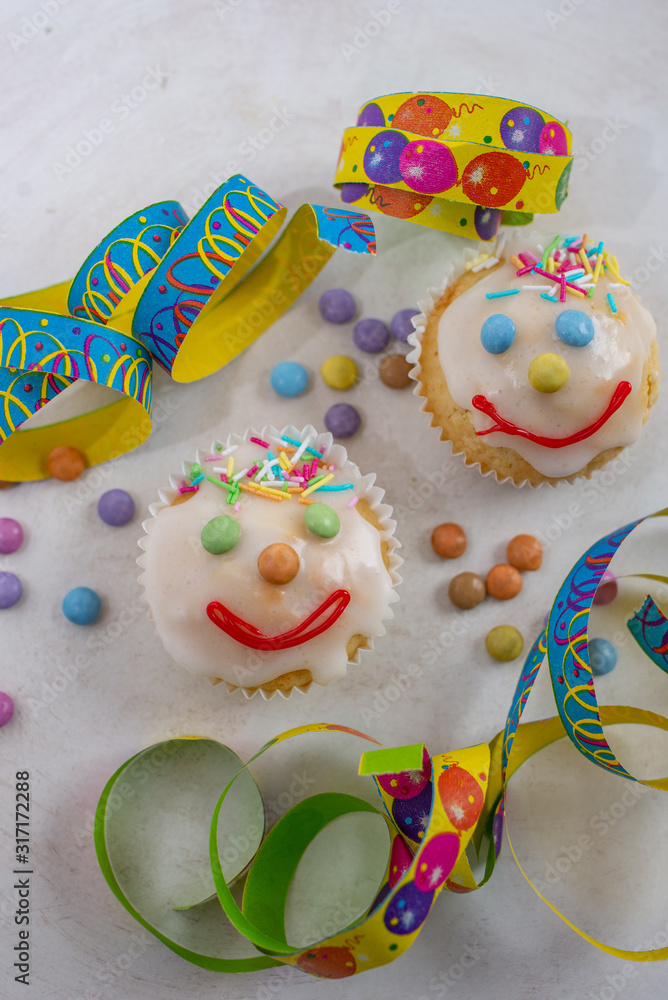 carnival clown muffins decorated with multi colored chocolate lentils