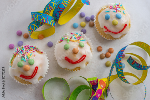 carnival clown muffins decorated with multi colored chocolate lentils