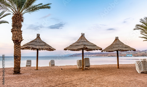 Morning, relaxing atmosphere at the central public beach in Eilat - famous tourist resort and recreational city in Israel  © sergei_fish13
