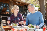 Couple dining in restaurant in open air
