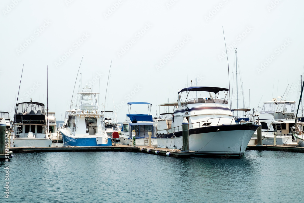Luxury yachts and fishing boats parked at pier of Nelson Bay