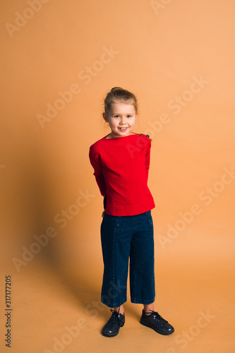 fashion shot cute girl posing on color background in studio © shapovalphoto