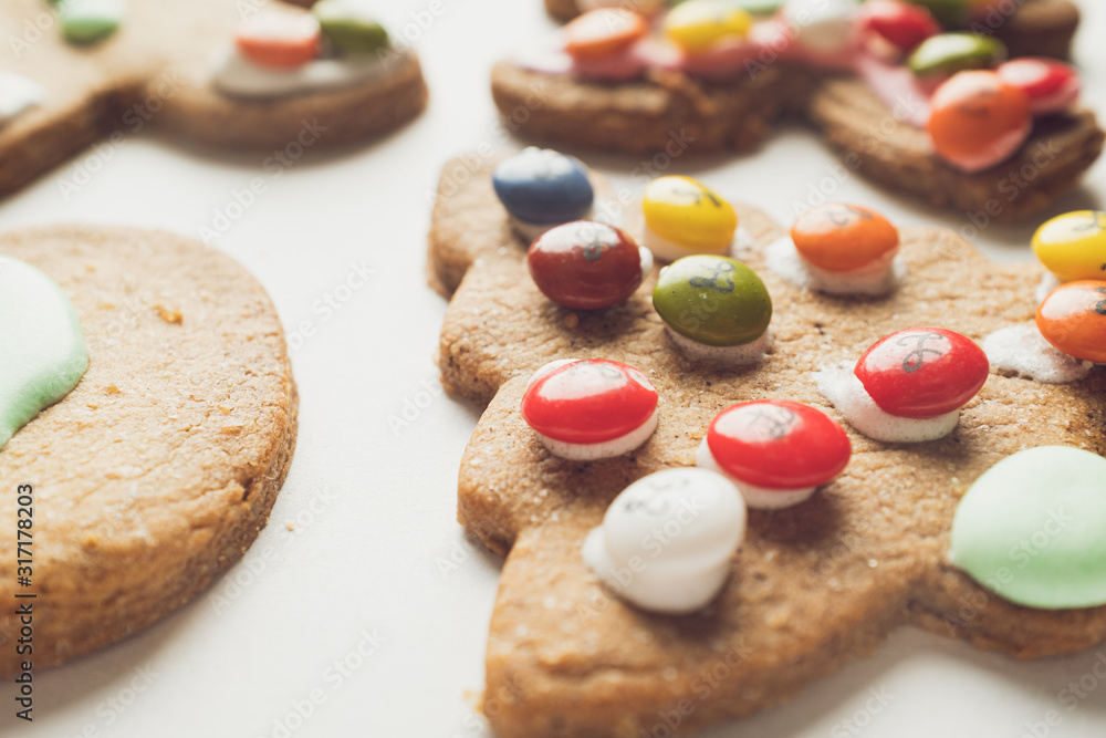 Handmade different shaped tasty cookies on a white shelf Handmade different shaped tasty cookies on a white shelf