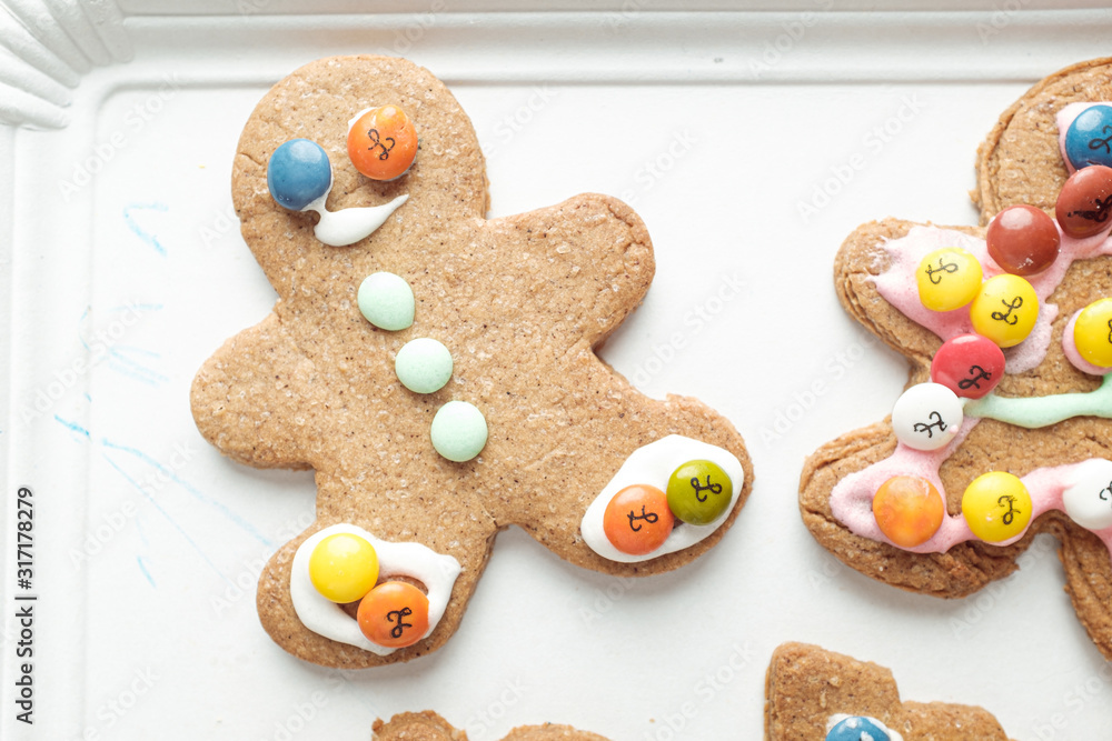 Handmade different shaped tasty cookies on a white shelf Handmade different shaped tasty cookies on a white shelf