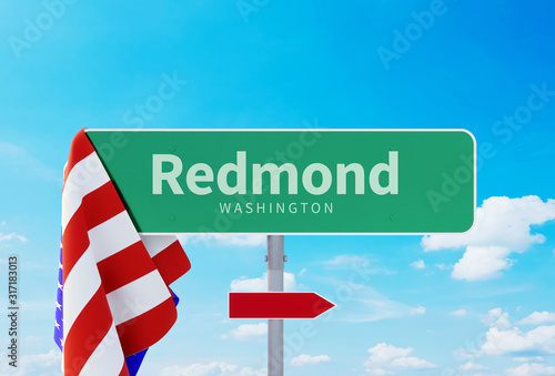 Redmond – Washington. Road or Town Sign. Flag of the united states. Blue Sky. Red arrow shows the direction in the city. 3d rendering photo