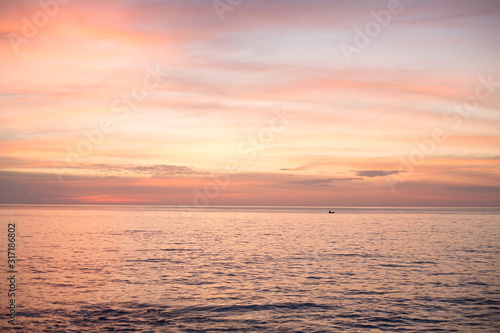 Sea pink sunset. Beautiful color clouds.