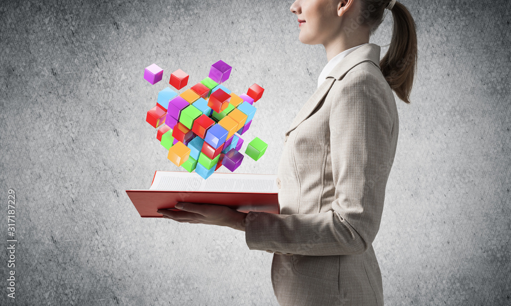 Woman showing colorful geometric 3d cubes Woman showing colorful geometric 3d cubes