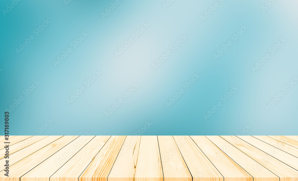 wood desk or wood floor with abstract blue blurred background for products display wood desk or wood floor with abstract blue blurred background for products display