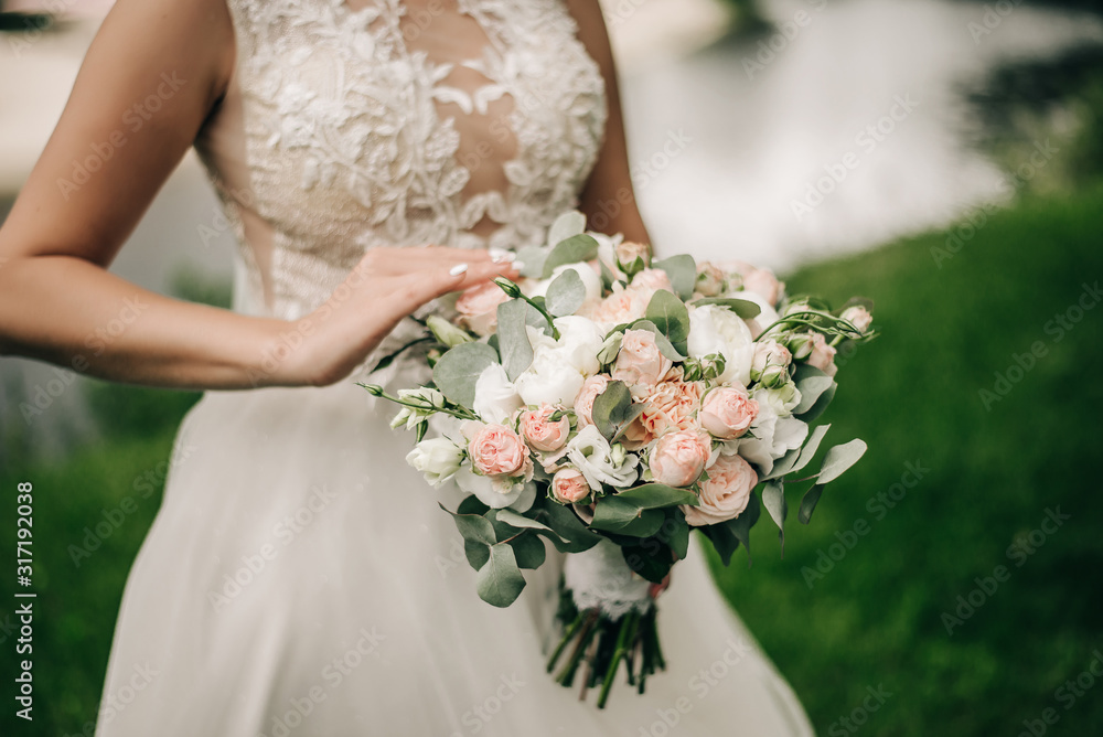 Bridal bouquet in the hands of the bride Bridal bouquet in the hands of the bride