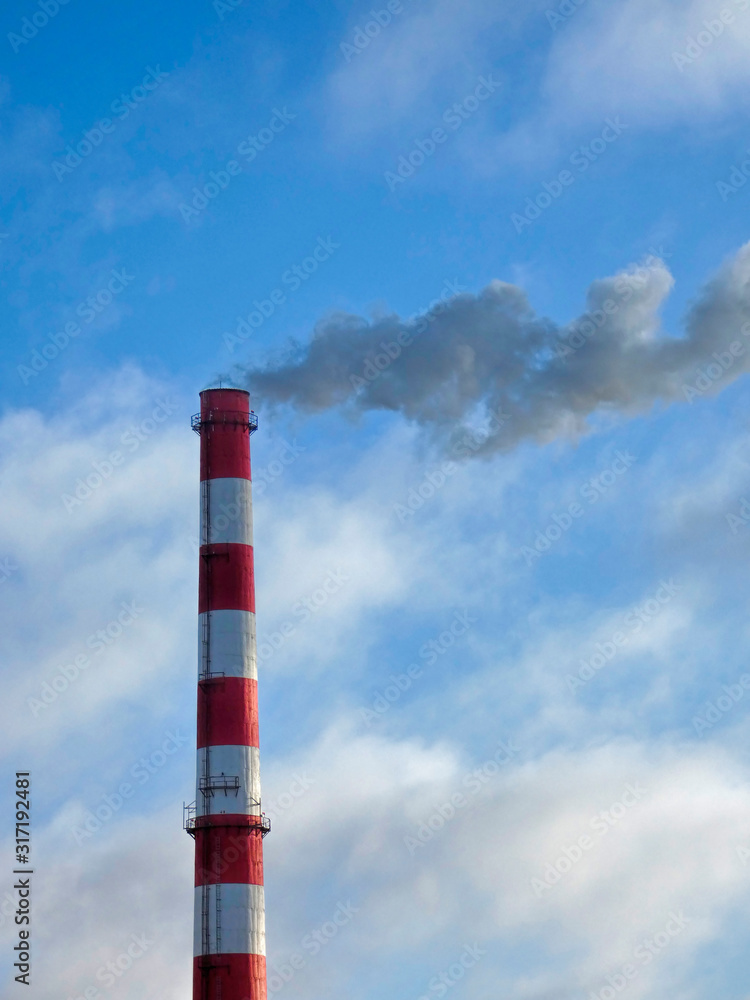 Big pipe with white smoke against blue sky. Environment pollution. Sunny winter day. Big pipe with white smoke against blue sky. Environment pollution. Sunny winter day.