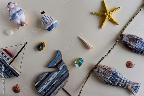 Nautical life style items: sea shells, fish, rope, lifebuoy. Marine concept.