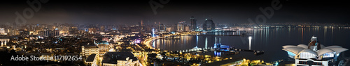 downtown baku city cityscape at night panorama landscape of capital of azerbaijan republic against black sky background. Panoramic aerial view of modern town skyline with skyscrapers on sea embankment