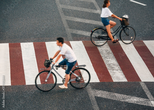 Photography People riding bicycle on crosswalk street city Japan street sign