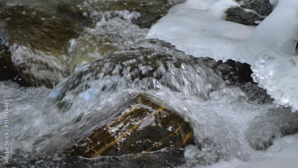little waterfall in a small river in the winter full of ice and snow little waterfall in a small river in the winter full of ice and snow