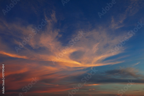 Sky and the clouds shined with sunset sun