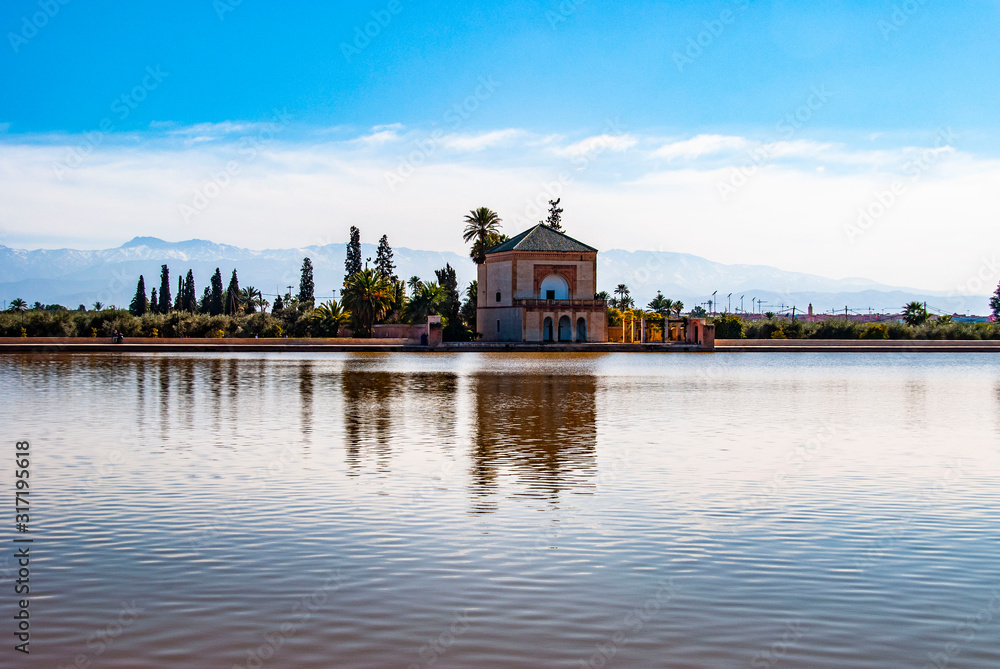 Menara gardens with Atlas mountains  in Marrakech, Morocco 