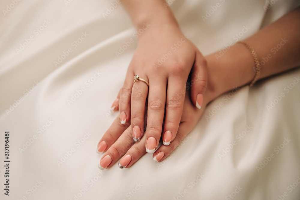 Nails of the bride on a white background Nails of the bride on a white background