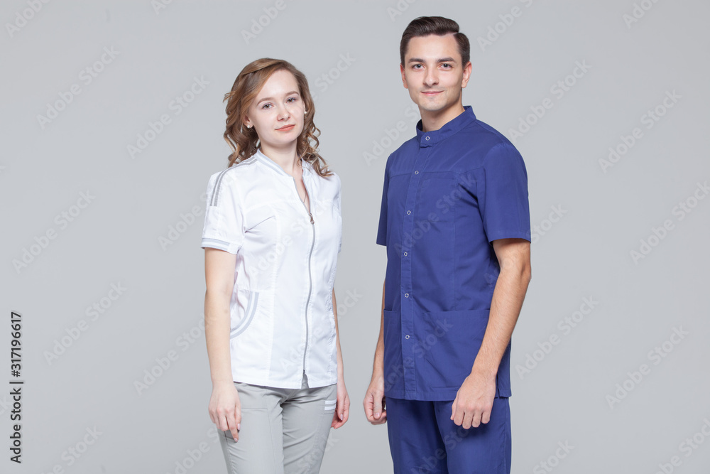 Portrait of young male and female doctors standing together Portrait of young male and female doctors standing together
