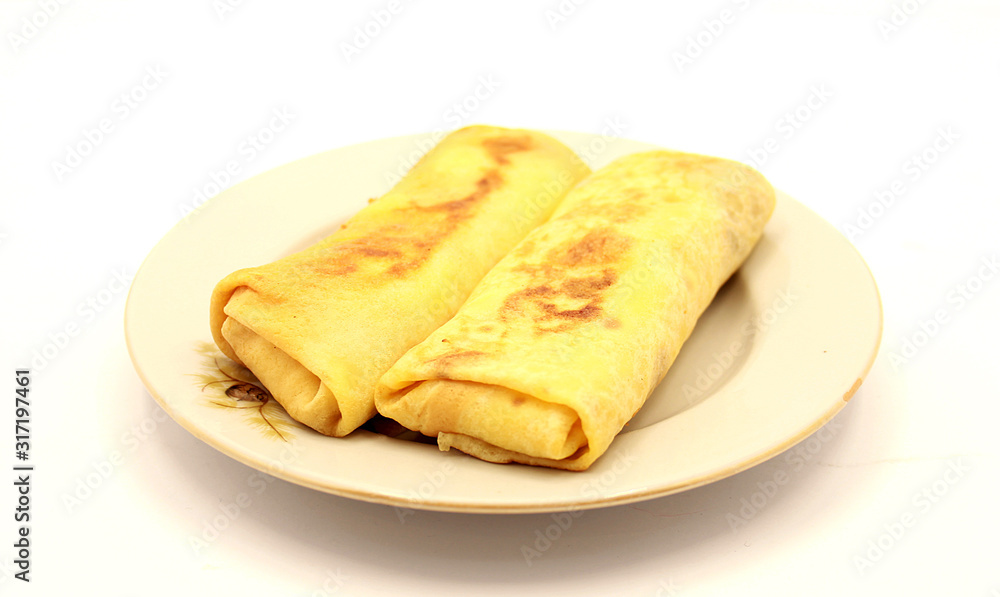 Pancakes with cottage cheese and raisins on a white background