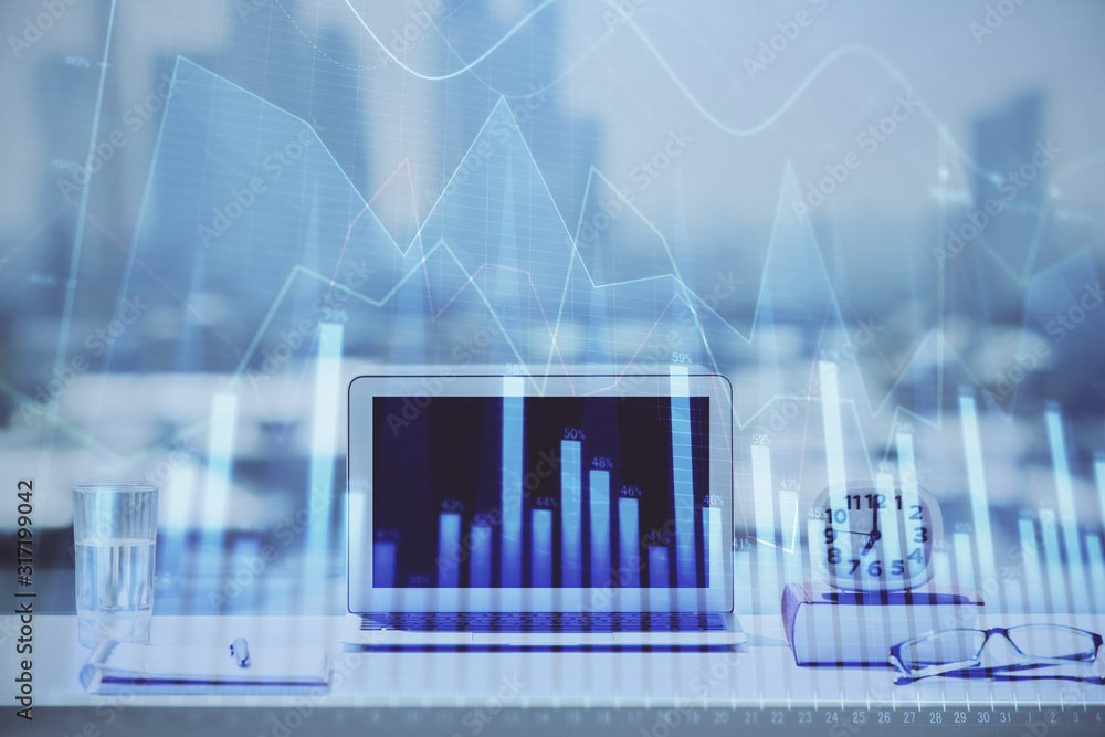 Forex graph hologram on table with computer background. Multi exposure. Concept of financial markets. Forex graph hologram on table with computer background. Multi exposure. Concept of financial markets.