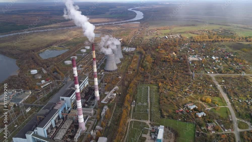 An energy station that generates heat and electric energy for heating and lighting urban homes. Aerial view.